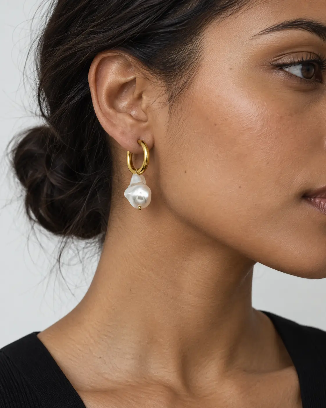 Woman wearing Pure Aura pearl earrings