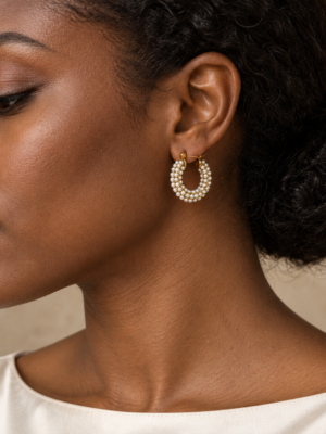 Vellora pearl hoop earrings worn on model